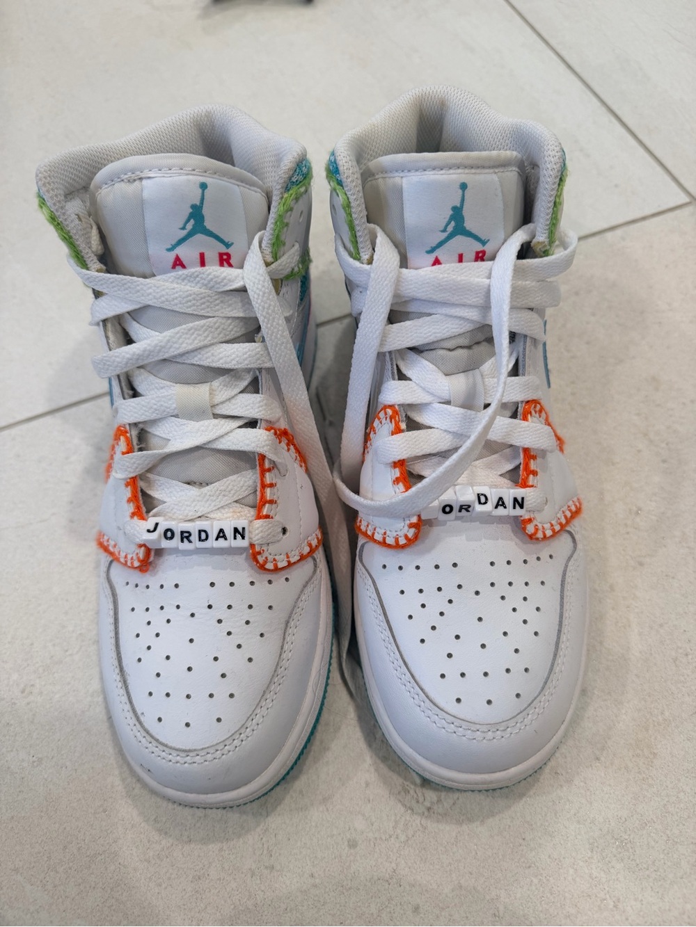 Nike Kids White High-Top Sneakers with Orange & Teal Accents